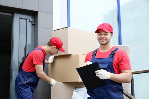Furniture and boxed belongings arranged for temporary storage in Kingston